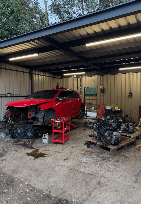 Mechanic inspecting vehicle